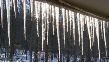 Icicles Hang From Roof Edge